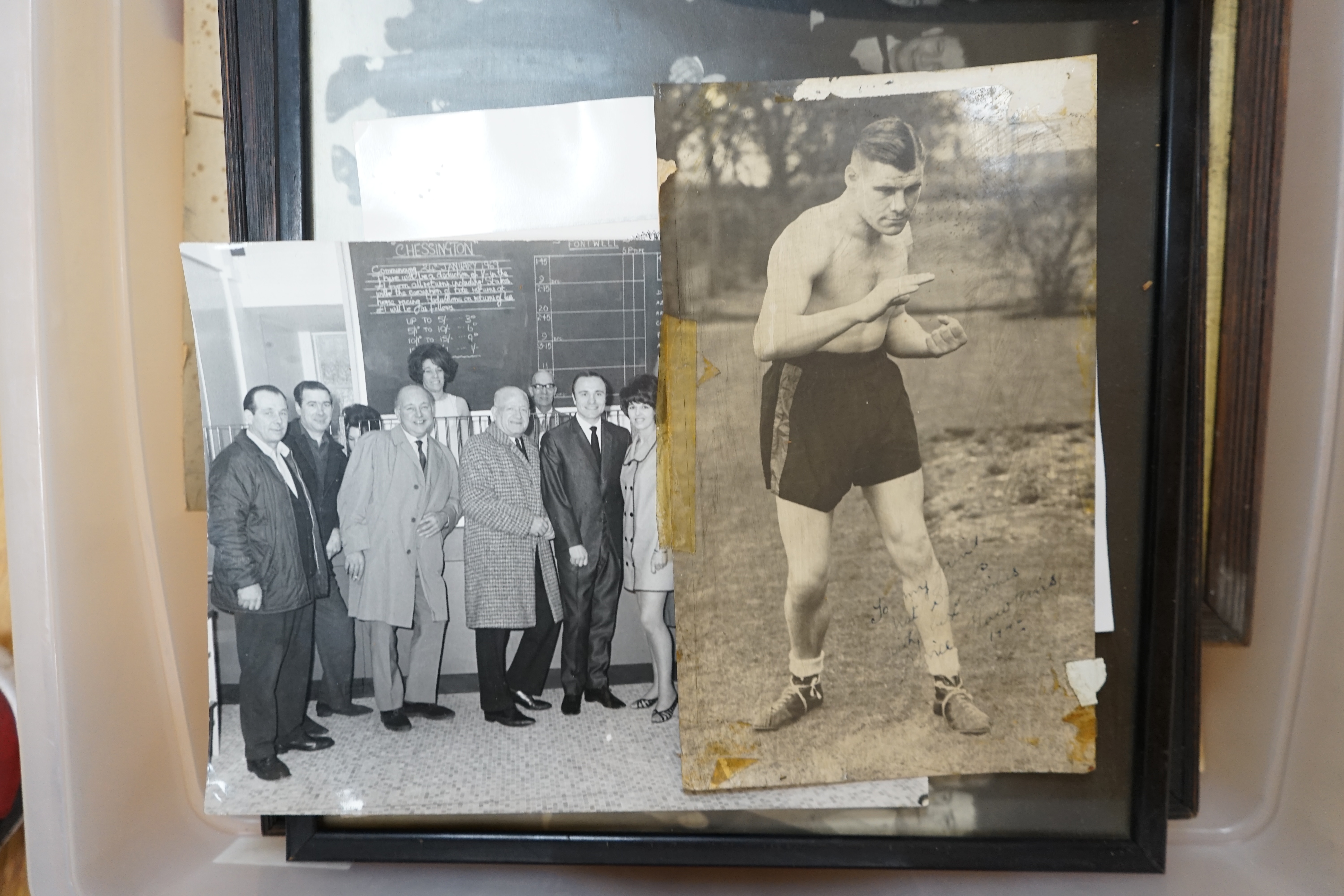 A collection of Jack Solomans boxing promo ephemera to include a shield shaped plaque, black and white photographs, books and a pastel portrait. Condition - varies